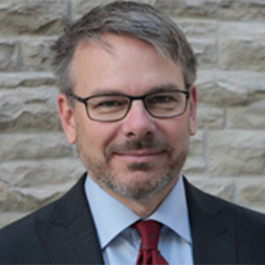 headshot of Scott MacDougall-Shackleton